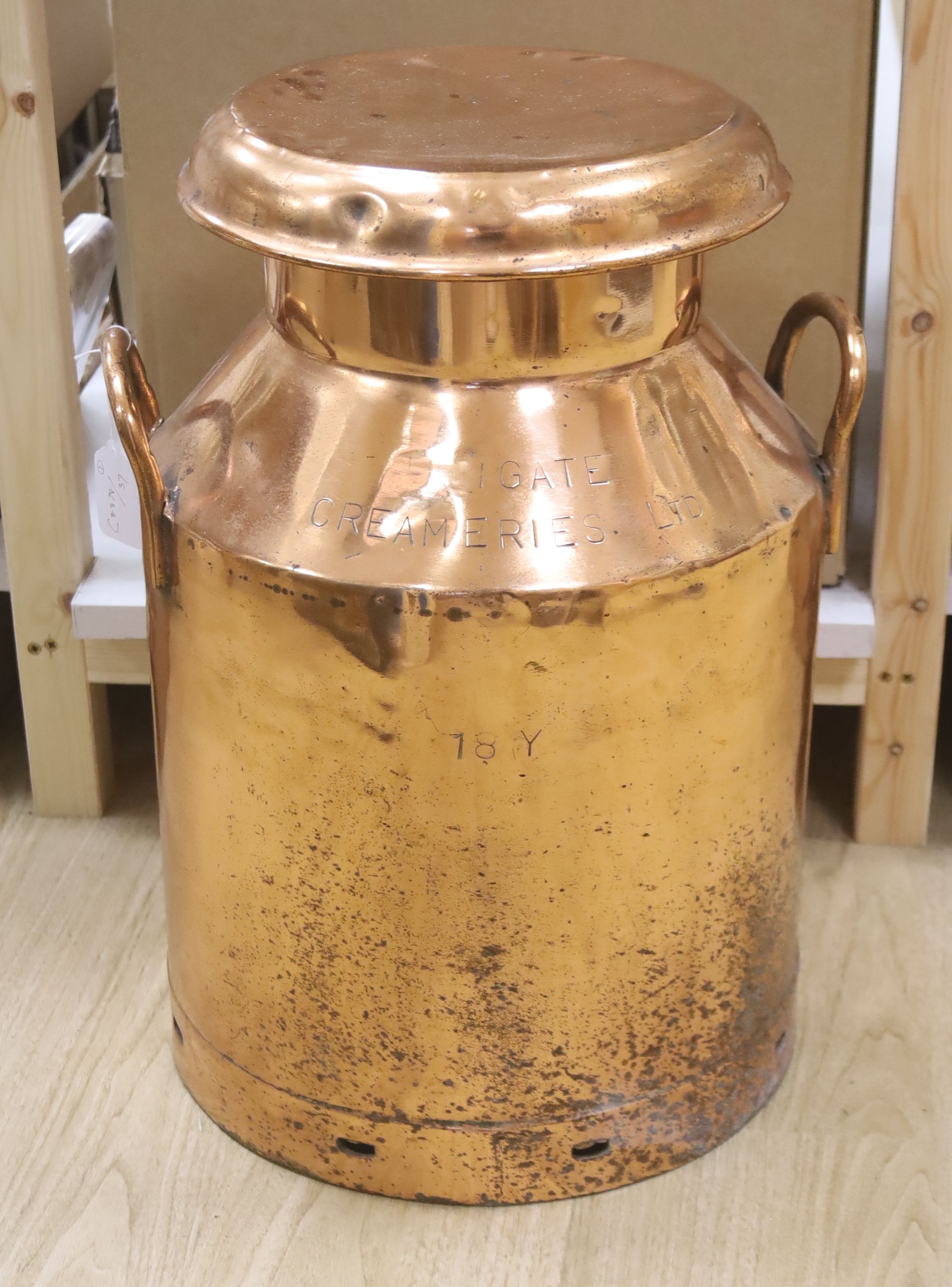 A copper milk churn, height 52cm